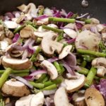 Veggies atop stir fry beef