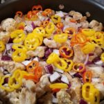 Chicken in Skillet with Colorful Peppers