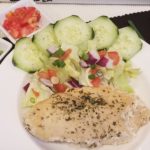 Chicken breast and vibrant green salad
